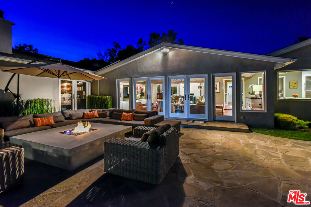16722 Adlon Road Encino, CA 91436 - Photo 34 of 36 a view of a house with swimming pool and sitting area