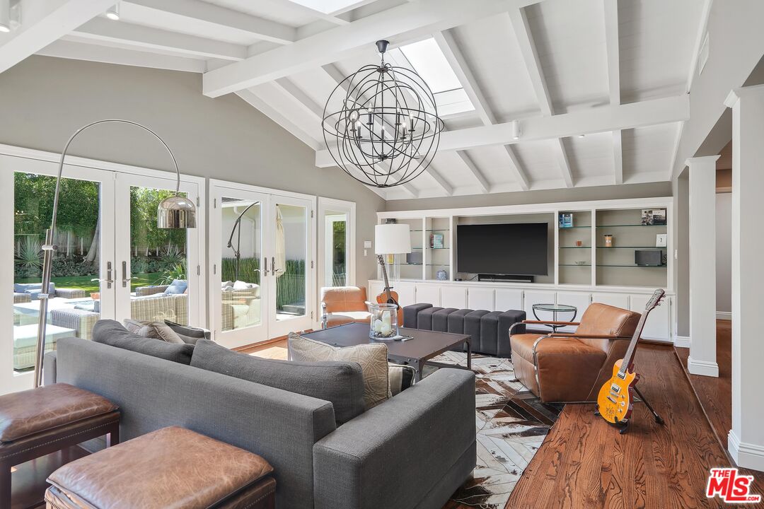 16722 Adlon Road Encino, CA 91436 - Photo 6 of 36 a living room with furniture chandelier and a large window