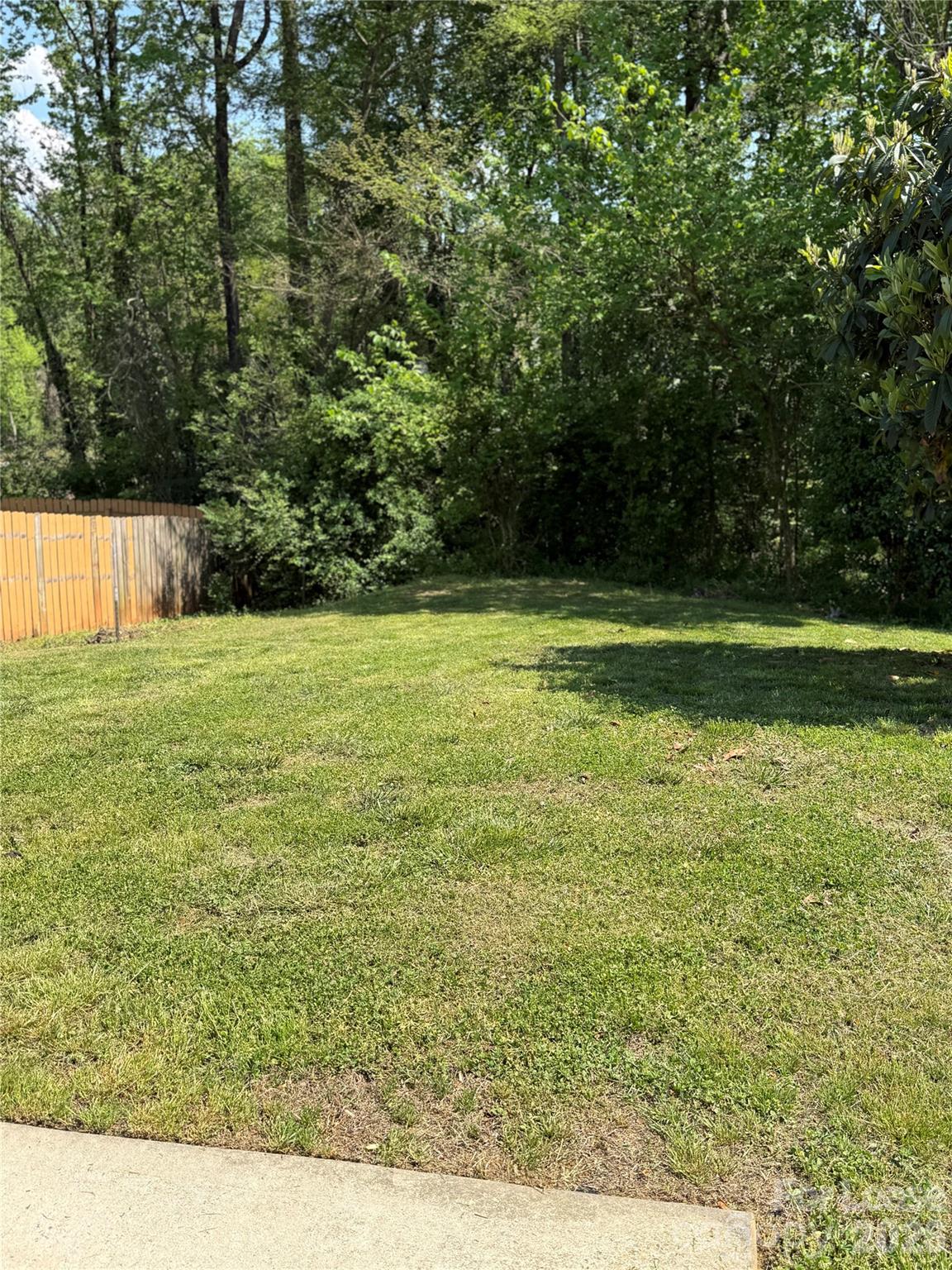 3329 Nevin Brook Road Charlotte, NC 28269 - Photo 13 of 13 a view of a green yard