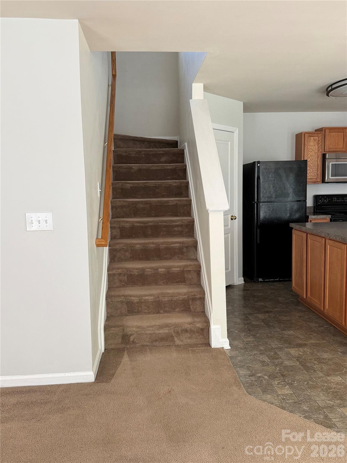 3329 Nevin Brook Road Charlotte, NC 28269 - Photo 5 of 13 a view of entryway and hall with wooden floor