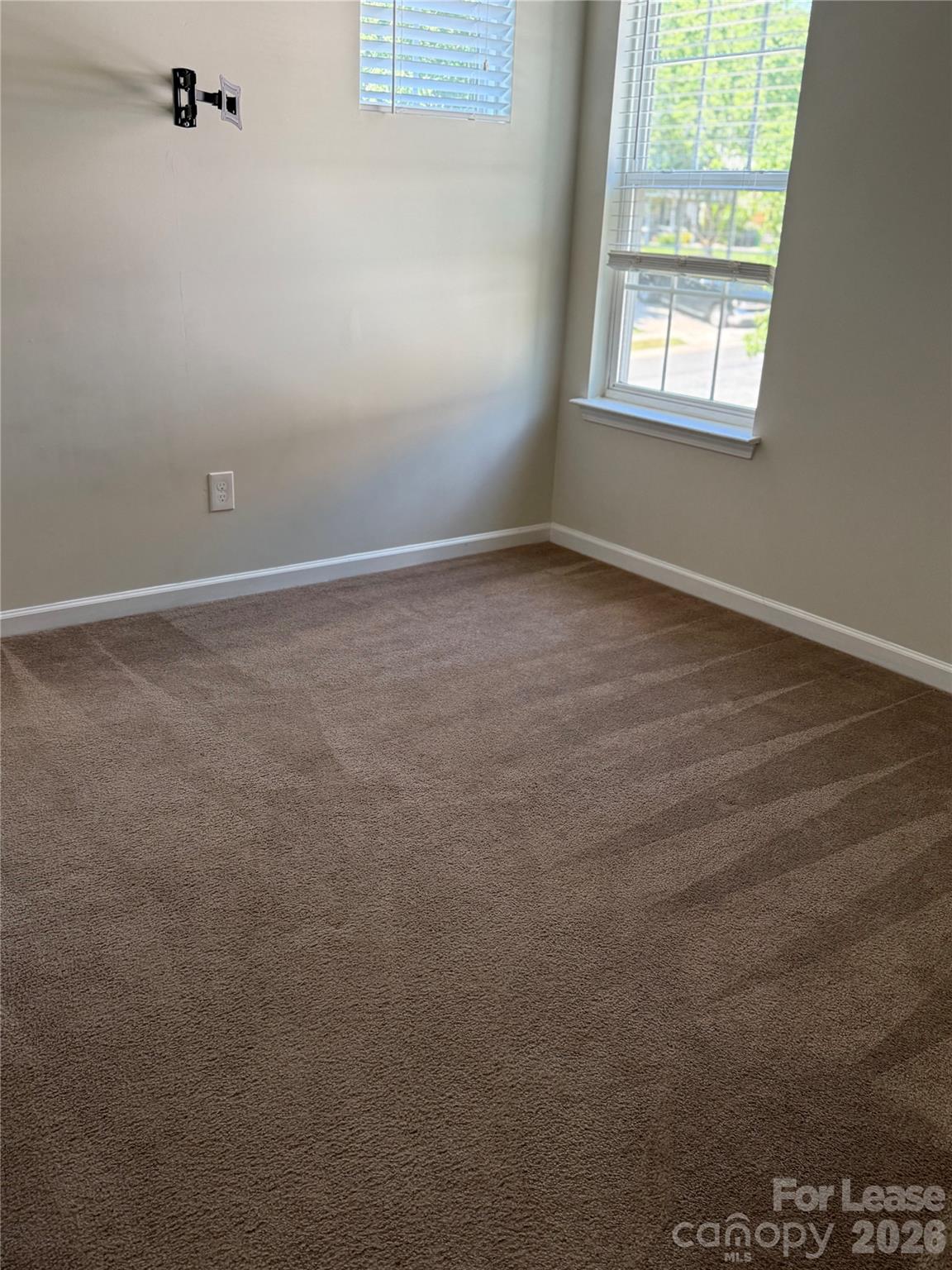 3329 Nevin Brook Road Charlotte, NC 28269 - Photo 7 of 13 an empty room with a window