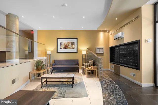 a living room with furniture and a rug