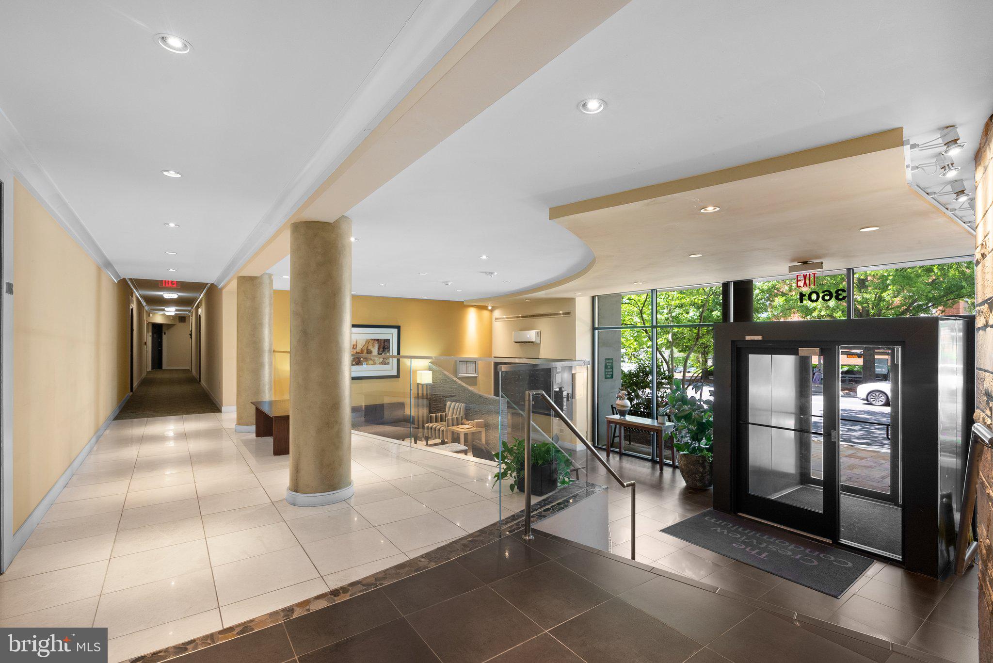 3601 Wisconsin Avenue Northwest, Unit 408 Washington, DC 20016 - Photo 14 of 17 a lobby with furniture and floor to ceiling window