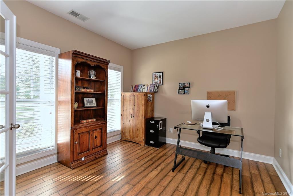 3321 Bridgewick Road Waxhaw, NC 28173 - Photo 2 of 24 a living room with furniture and a wooden floor