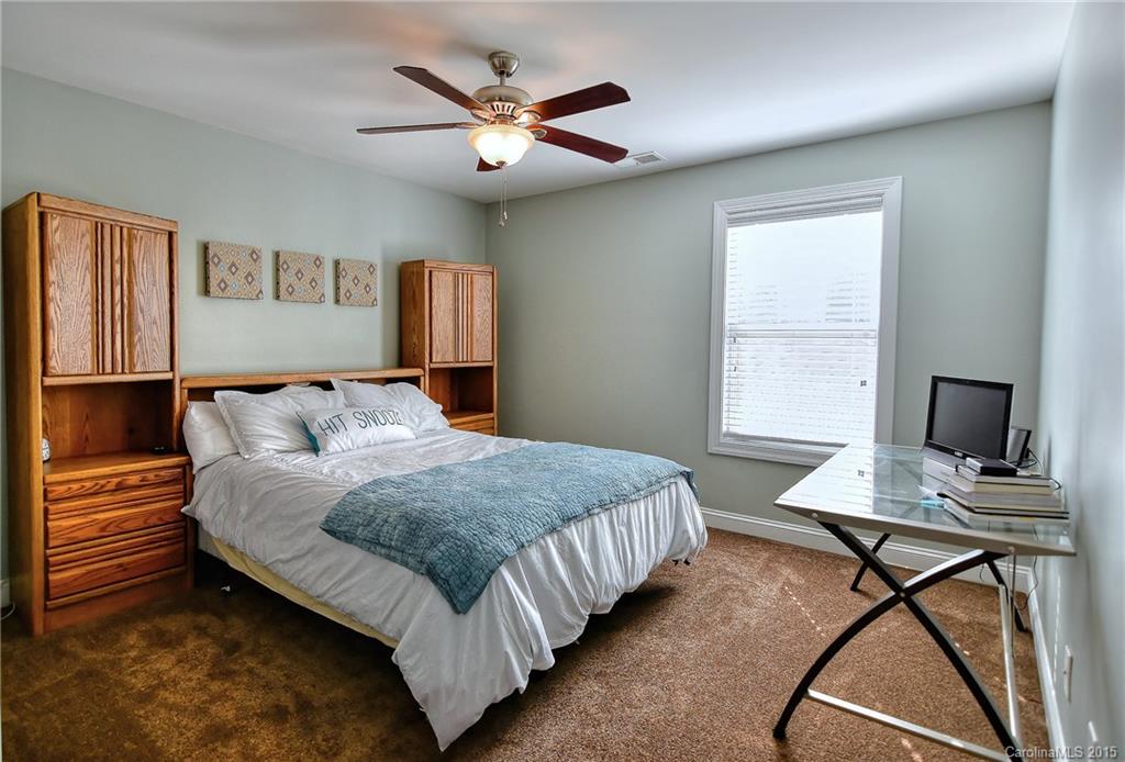 3321 Bridgewick Road Waxhaw, NC 28173 - Photo 12 of 24 a spacious bedroom with a bed and a window