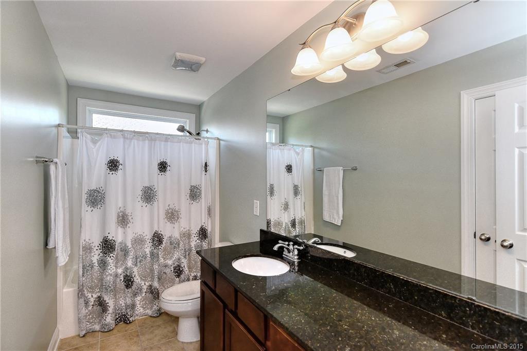 3321 Bridgewick Road Waxhaw, NC 28173 - Photo 15 of 24 a bathroom with a granite countertop sink and a mirror
