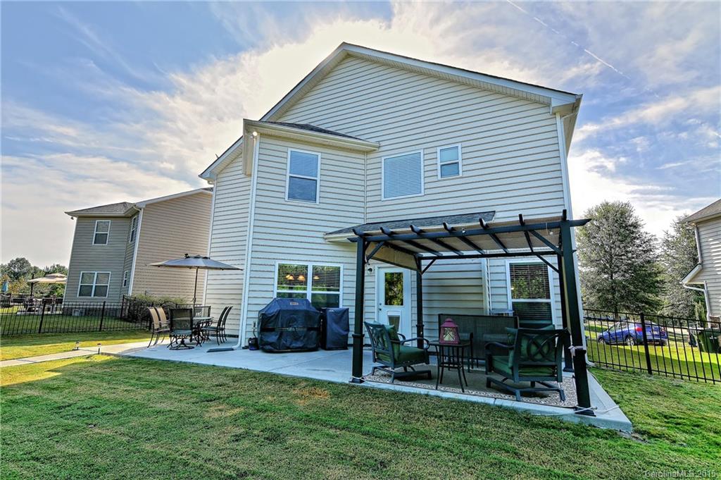 3321 Bridgewick Road Waxhaw, NC 28173 - Photo 17 of 24 a view of a house with a yard and sitting area