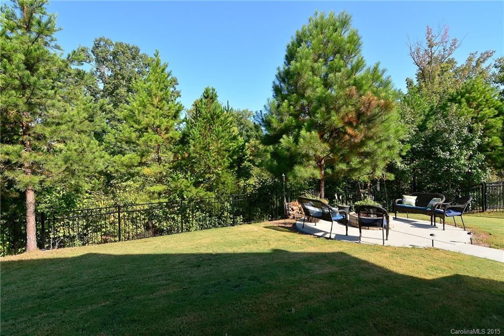3321 Bridgewick Road Waxhaw, NC 28173 - Photo 18 of 24 a swimming pool with outdoor seating and yard