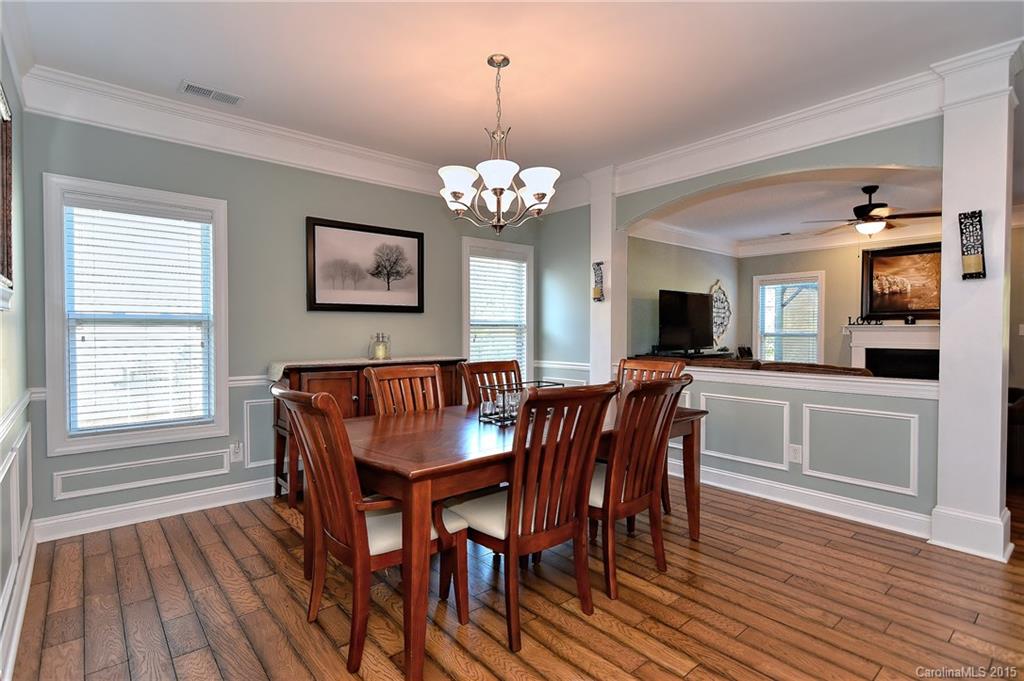 3321 Bridgewick Road Waxhaw, NC 28173 - Photo 3 of 24 a view of a dining room with furniture window and wooden floor