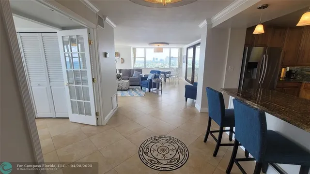 a view of a livingroom with furniture and a window