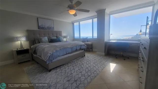 a bedroom with a bed and a lamp