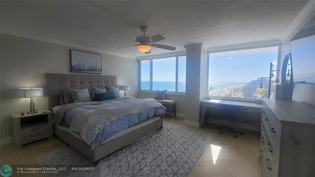 a bedroom with a bed lamps and window