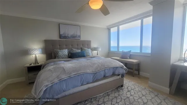 a bedroom with a bed and a lamp