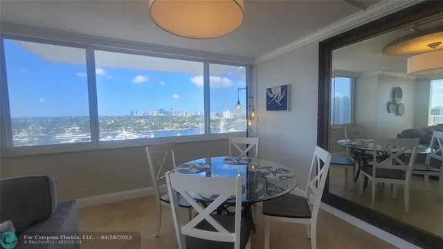 a view of a dining room with furniture window and outside view
