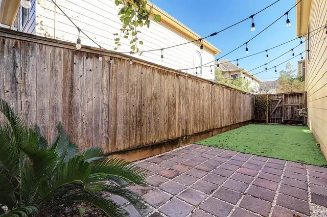 a bathroom with a granite countertop tub sink and mirror