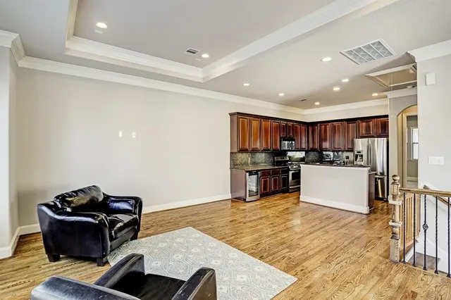 a view of a house with a small yard and wooden fence