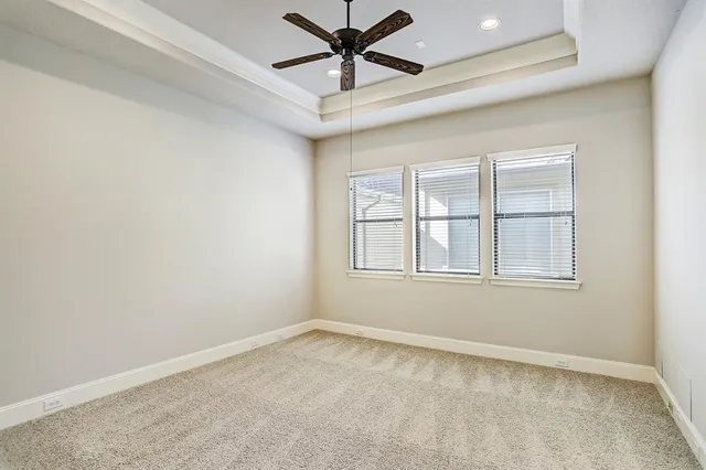 a kitchen that has a sink a stove and wooden floor