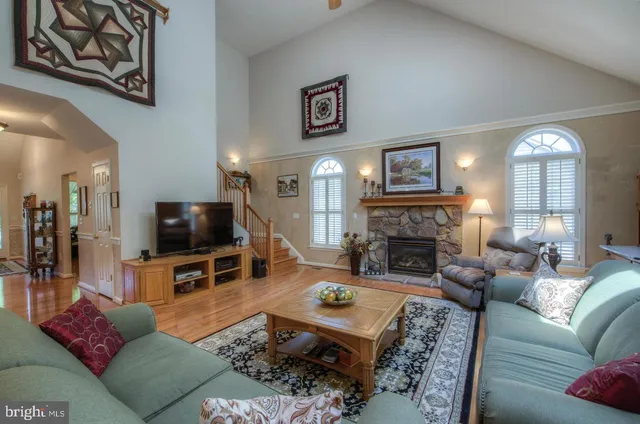 a dining room with furniture and chandelier