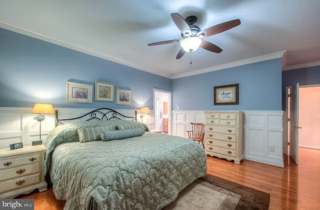a kitchen with granite countertop kitchen island stainless steel appliances a sink stove and cabinets