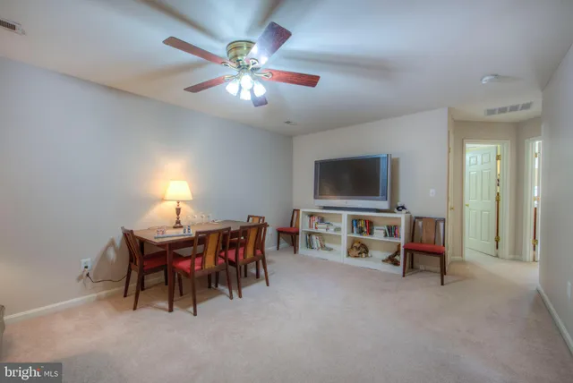 a view of room with walk in closet and window