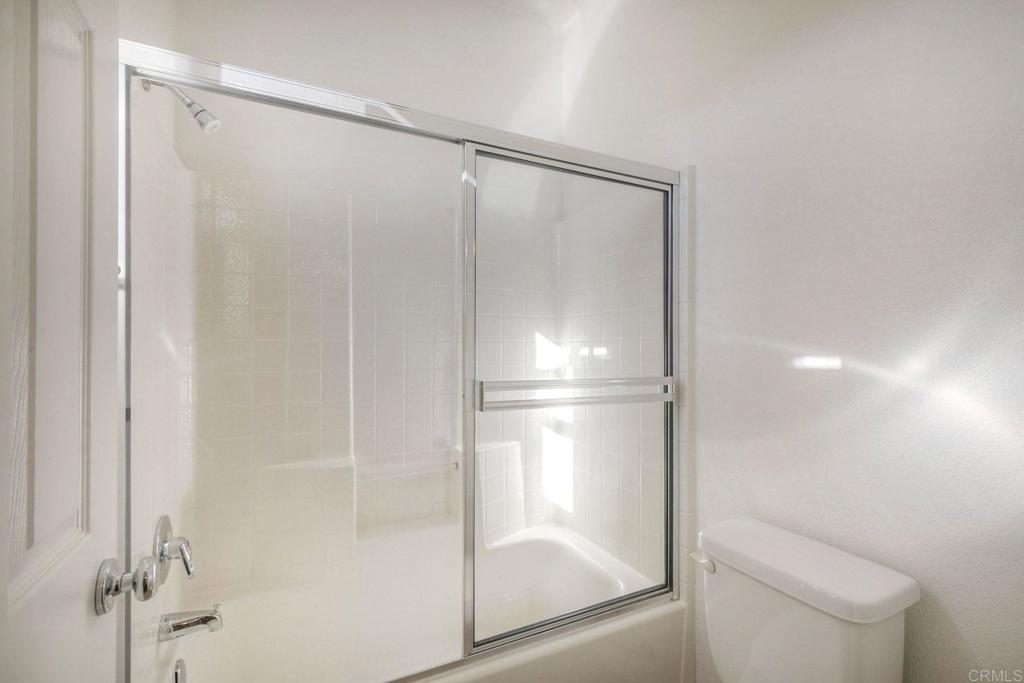 3840 Stoneridge Road Carlsbad, CA 92010 - Photo 20 of 36 a bathroom with a glass shower door