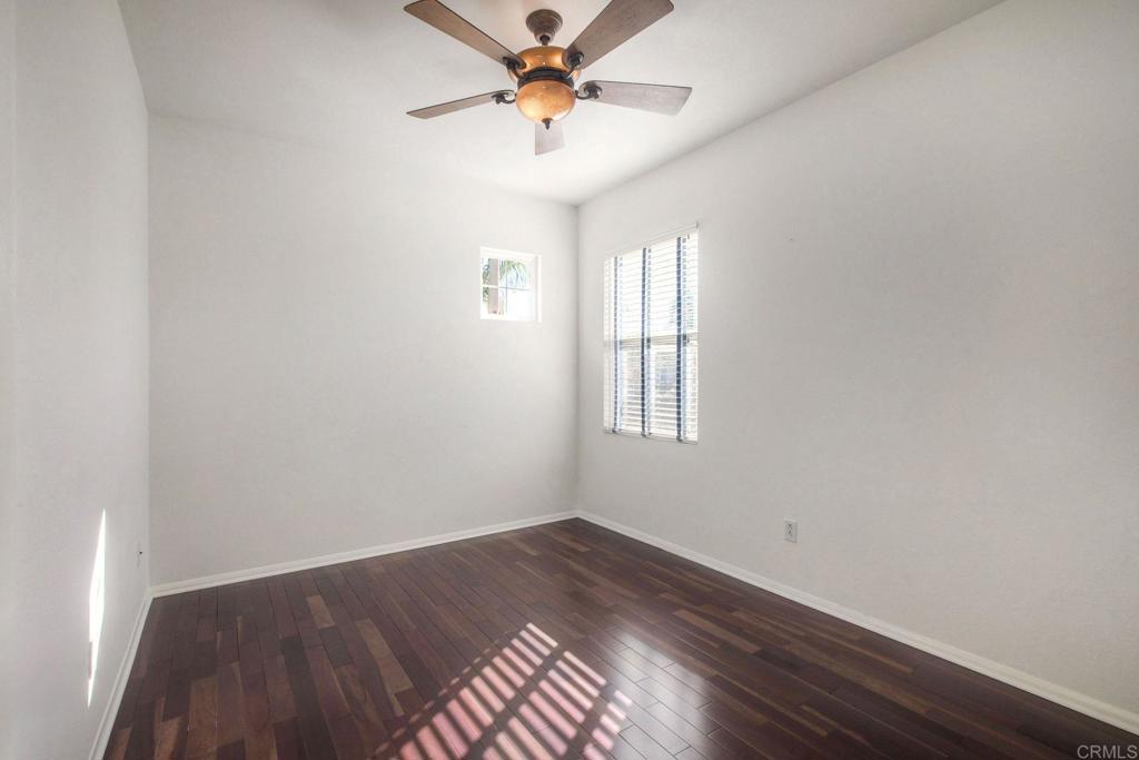 3840 Stoneridge Road Carlsbad, CA 92010 - Photo 21 of 36 an empty room with windows and fan