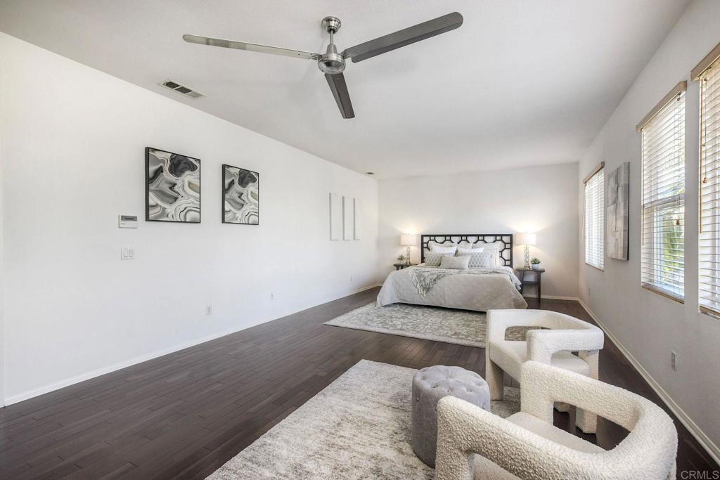 3840 Stoneridge Road Carlsbad, CA 92010 - Photo 24 of 36 a bedroom with a large bed and a couch
