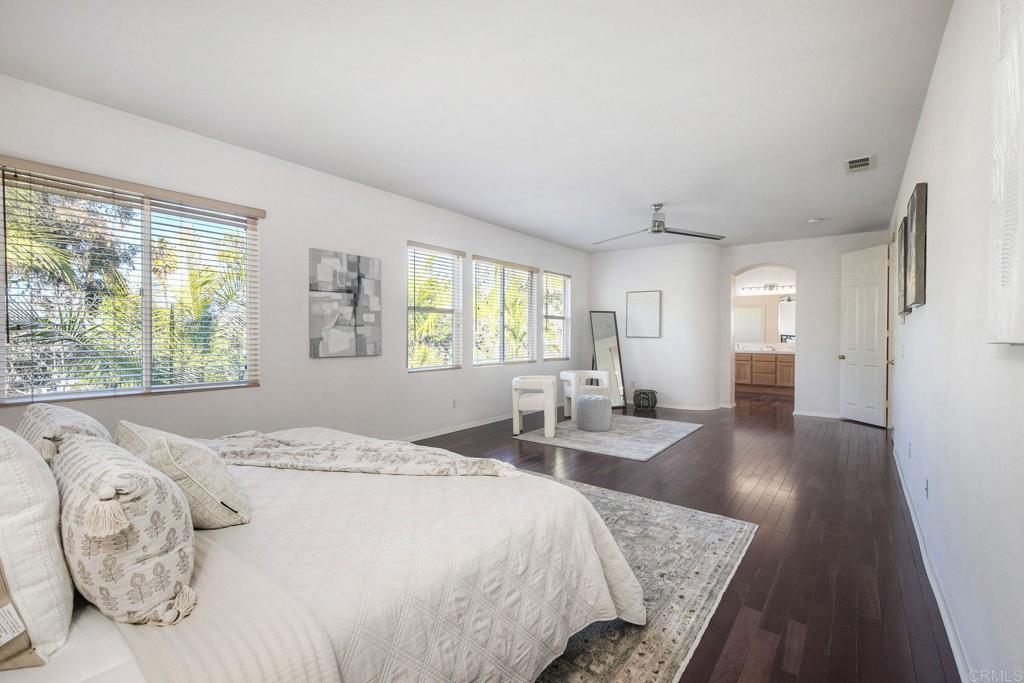 3840 Stoneridge Road Carlsbad, CA 92010 - Photo 25 of 36 a bed room with a bed and a chair
