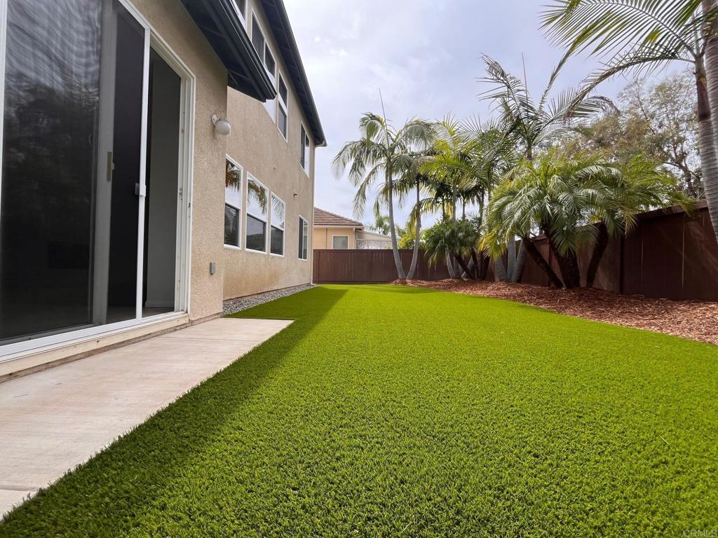 3840 Stoneridge Road Carlsbad, CA 92010 - Photo 29 of 36 a view of a house with a yard