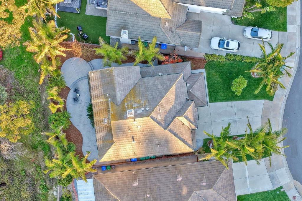 3840 Stoneridge Road Carlsbad, CA 92010 - Photo 33 of 36 an aerial view of a house with garden space and a bench
