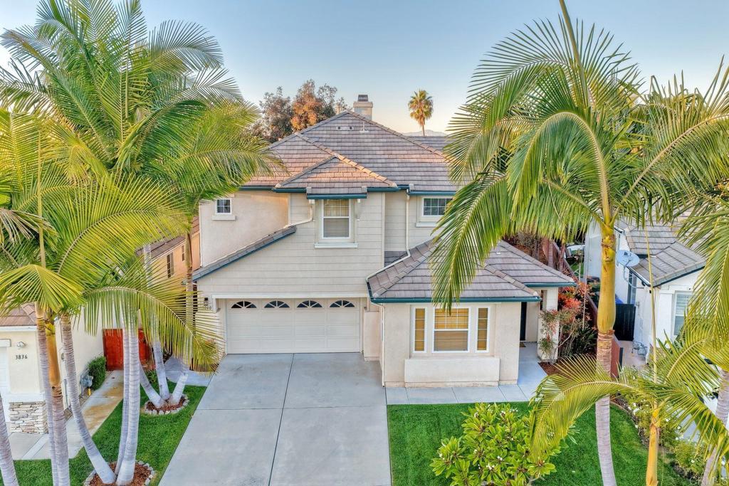 3840 Stoneridge Road Carlsbad, CA 92010 - Photo 36 of 36 a view of a house with a small yard and plants