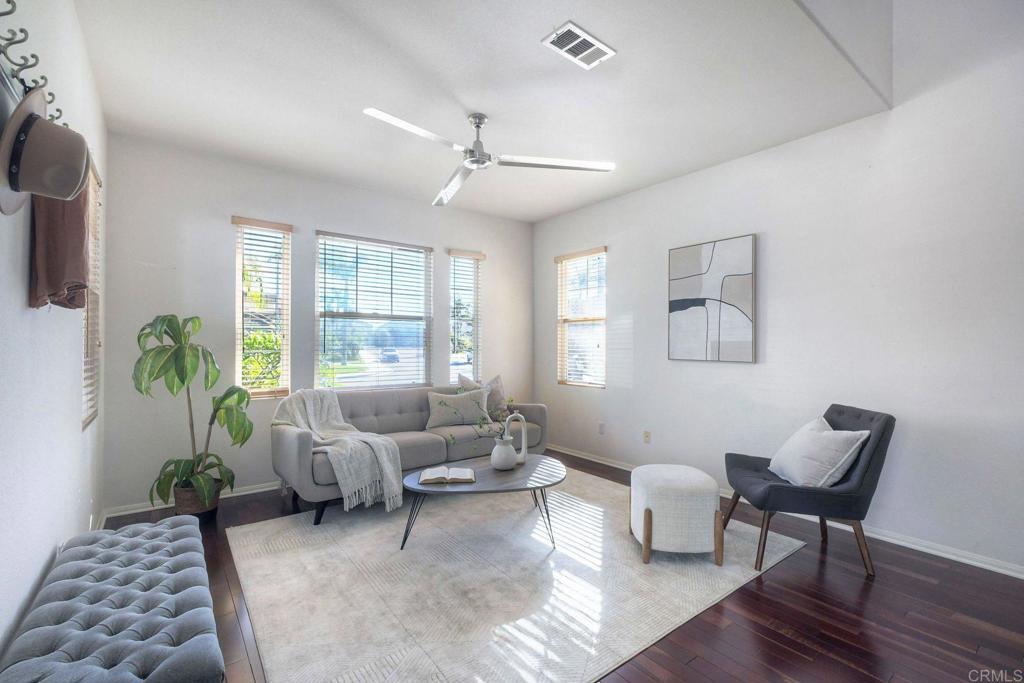 3840 Stoneridge Road Carlsbad, CA 92010 - Photo 4 of 36 a living room with furniture and a potted plant