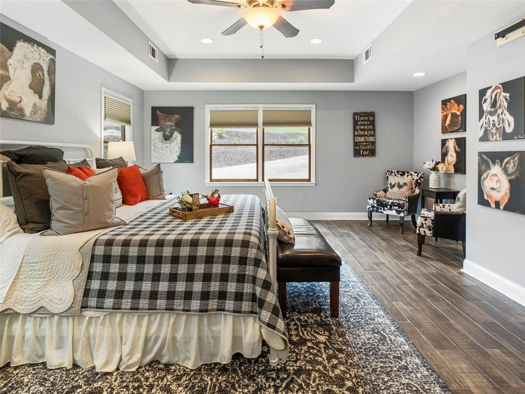 253 Happy Trails Way Jasper, GA 30143 - Photo 101 of 147 a bedroom with a bed and wooden floor