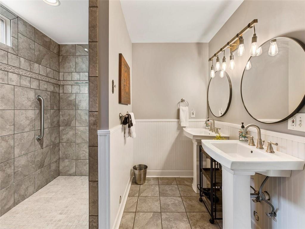 253 Happy Trails Way Jasper, GA 30143 - Photo 106 of 147 a bathroom with a sink and a mirror