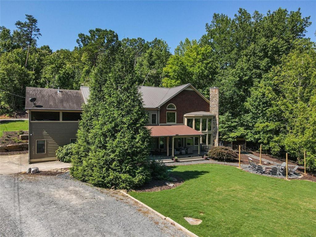 253 Happy Trails Way Jasper, GA 30143 - Photo 117 of 147 a front view of a house with garden