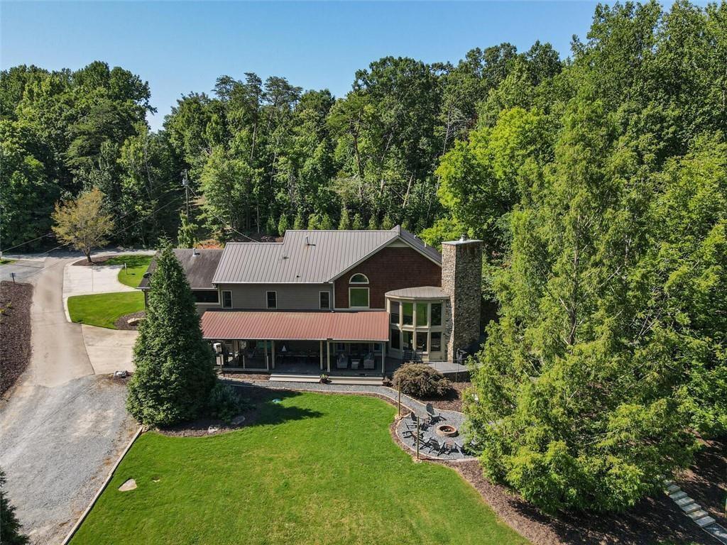 253 Happy Trails Way Jasper, GA 30143 - Photo 119 of 147 a aerial view of a house with swimming pool next to a big yard