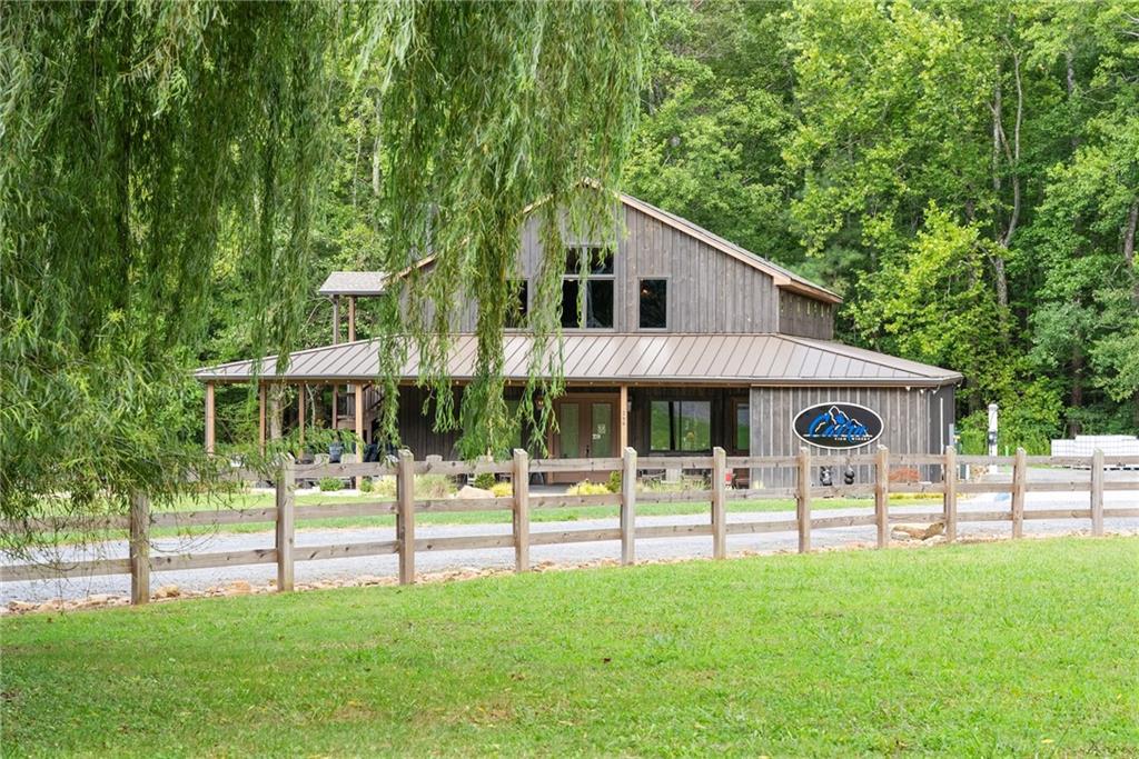253 Happy Trails Way Jasper, GA 30143 - Photo 132 of 147 a view of a house with backyard and a tree