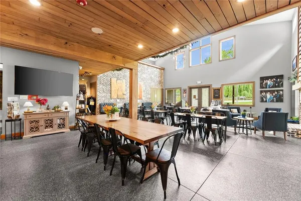 a kitchen with granite countertop a stove sink and cabinets