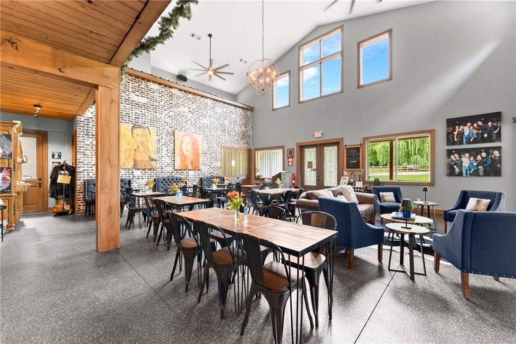 253 Happy Trails Way Jasper, GA 30143 - Photo 25 of 147 a view of a dining area with furniture and a potted plant