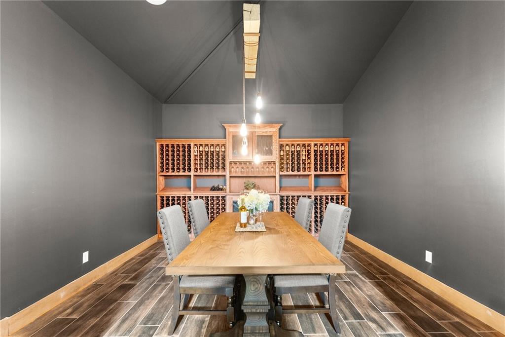 253 Happy Trails Way Jasper, GA 30143 - Photo 31 of 147 a view of a dining room with furniture a chandelier and wooden floor