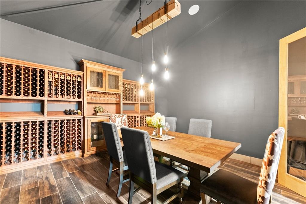 253 Happy Trails Way Jasper, GA 30143 - Photo 33 of 147 a view of a dining room with furniture and wooden floor
