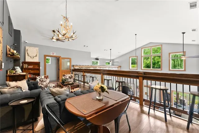 a view of a house with swimming pool and sitting area