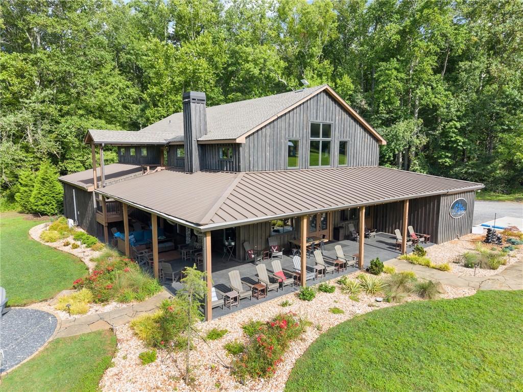 253 Happy Trails Way Jasper, GA 30143 - Photo 5 of 147 a front view of a house with a yard patio and fire pit