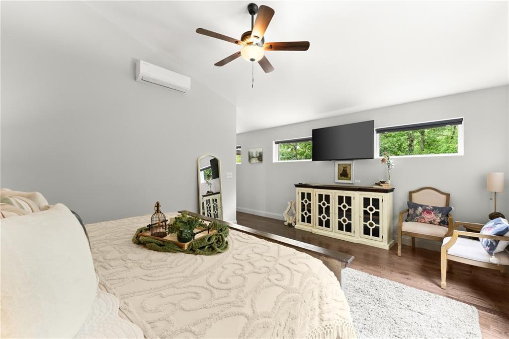 253 Happy Trails Way Jasper, GA 30143 - Photo 51 of 147 a bedroom with a bed couch and a window