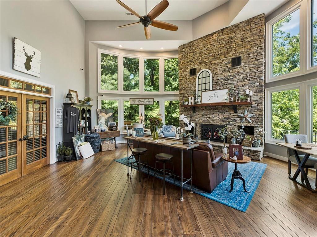 253 Happy Trails Way Jasper, GA 30143 - Photo 72 of 147 a living room with furniture a fireplace and wooden floor