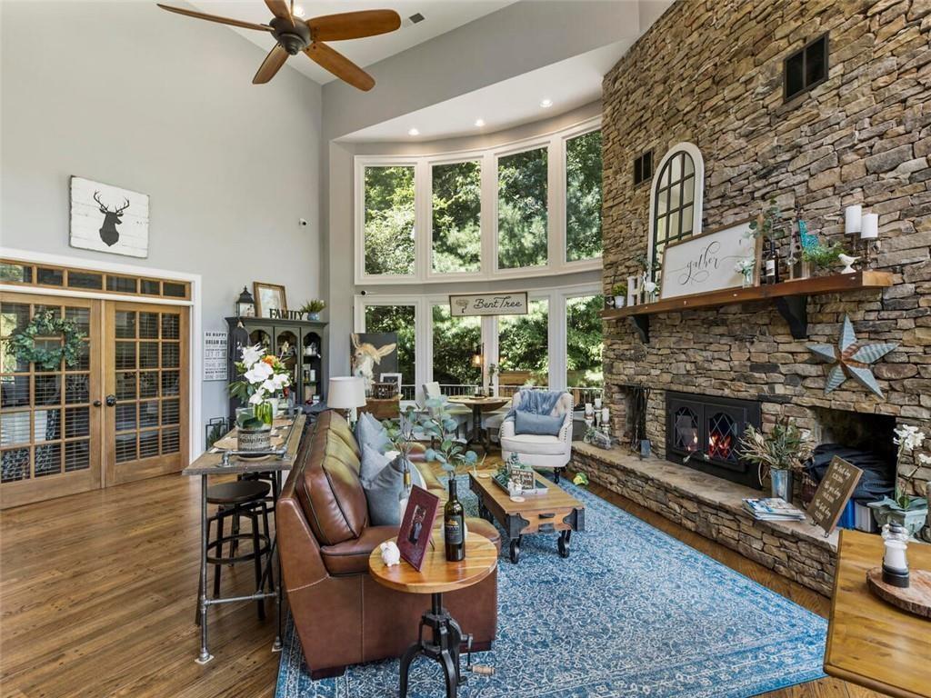 253 Happy Trails Way Jasper, GA 30143 - Photo 78 of 147 a living room with furniture a window and a fireplace