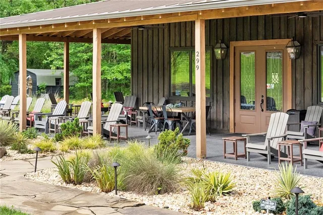 a kitchen with kitchen island granite countertop lots of counter top space and stainless steel appliances