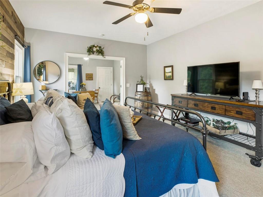 253 Happy Trails Way Jasper, GA 30143 - Photo 82 of 147 a living room with furniture and a flat screen tv