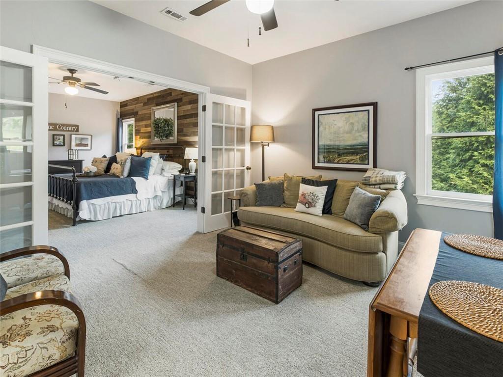 253 Happy Trails Way Jasper, GA 30143 - Photo 85 of 147 a living room with furniture and a large window