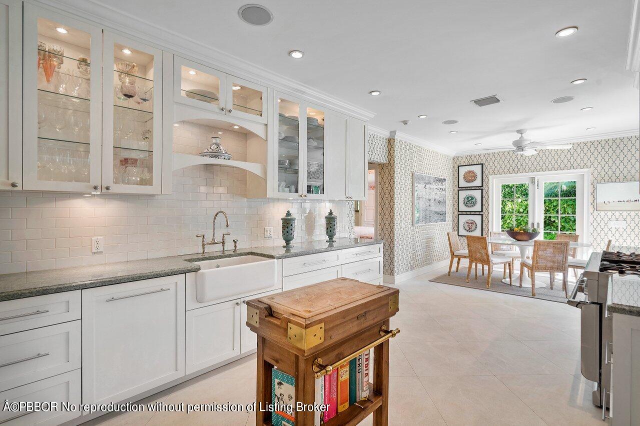 265 List Road Palm Beach, FL 33480 - Photo 12 of 39 a kitchen with furniture and windows